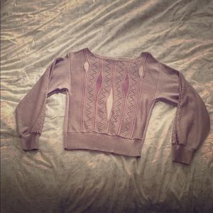A lavender Sakowitz abstract patterned sweater.